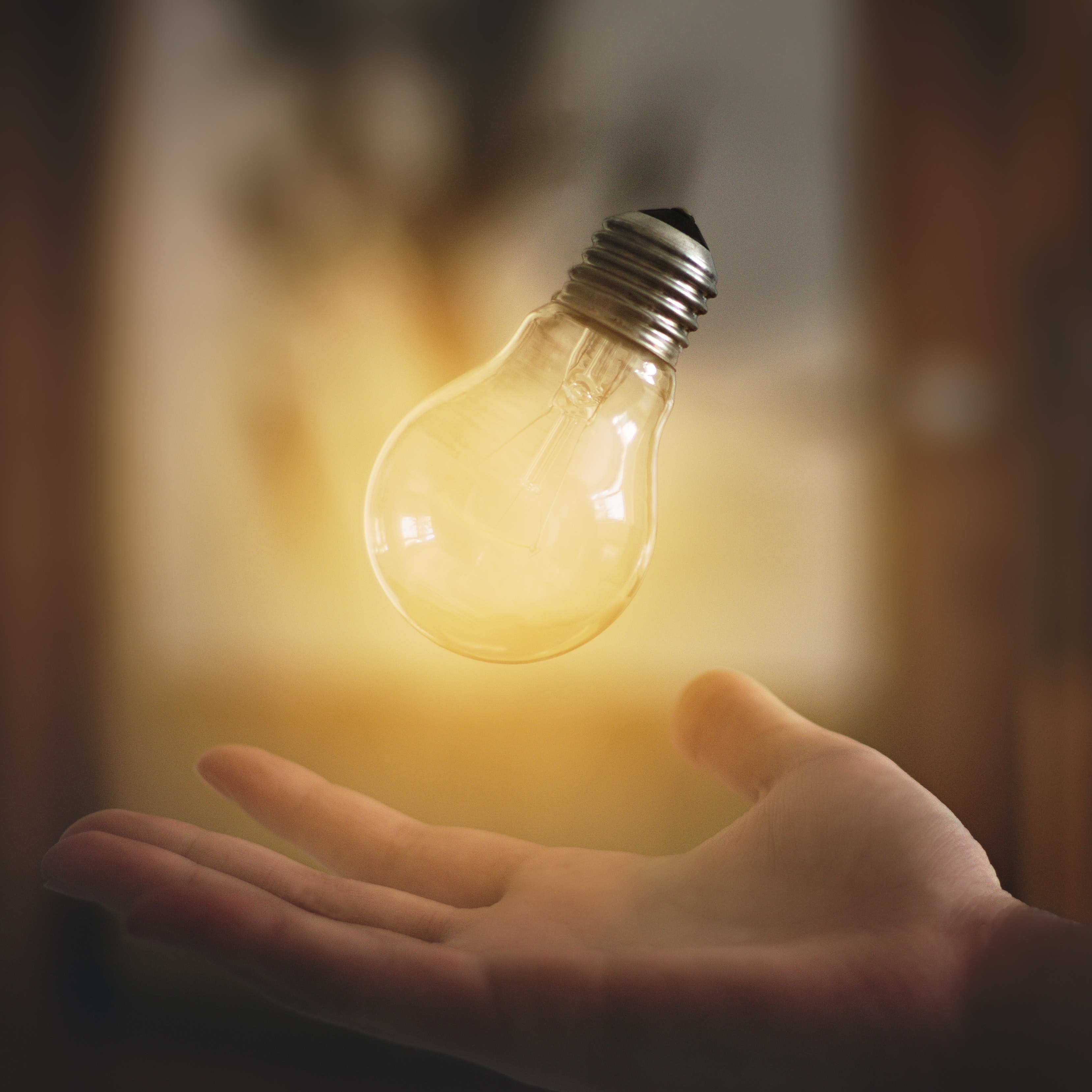 holding a bright idea in your hand